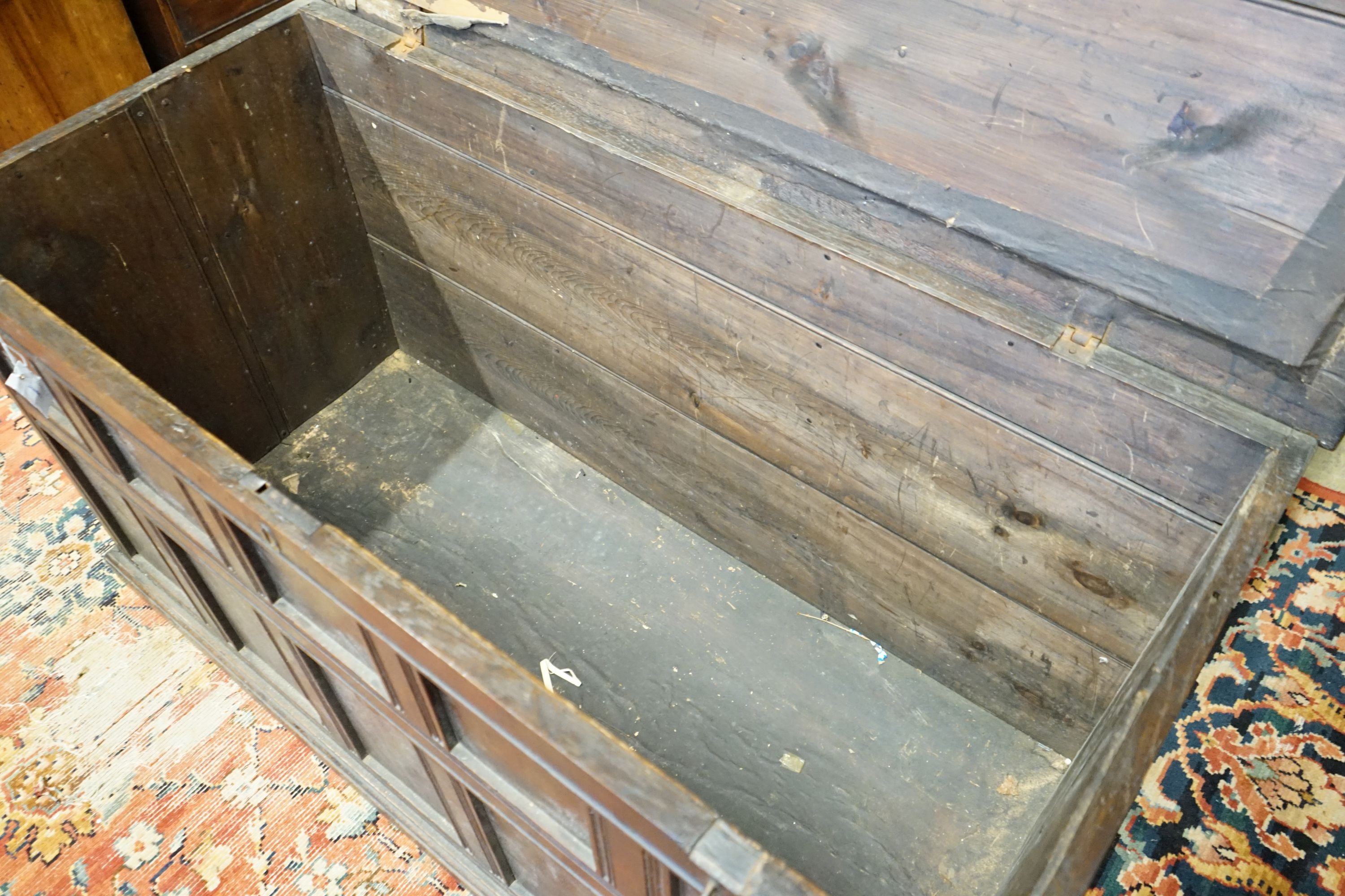 An 18th century panelled oak coffer, length 147cm, depth 67cm, height 80cm